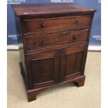 A 19th Century mahogany square fronted chest of two drawers over two cupboard doors on bracket feet