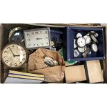 A suitcase containing various pocket watches, wristwatches,