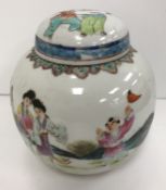 A Chinese polychrome decorated ginger jar and cover, the cover painted with two figures,