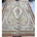 An Aubusson rug in terracotta and cream within foliate design,
