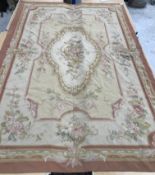 An Aubusson rug in terracotta and cream within foliate design,