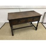An oak two drawer side table in the 17th Century style,
