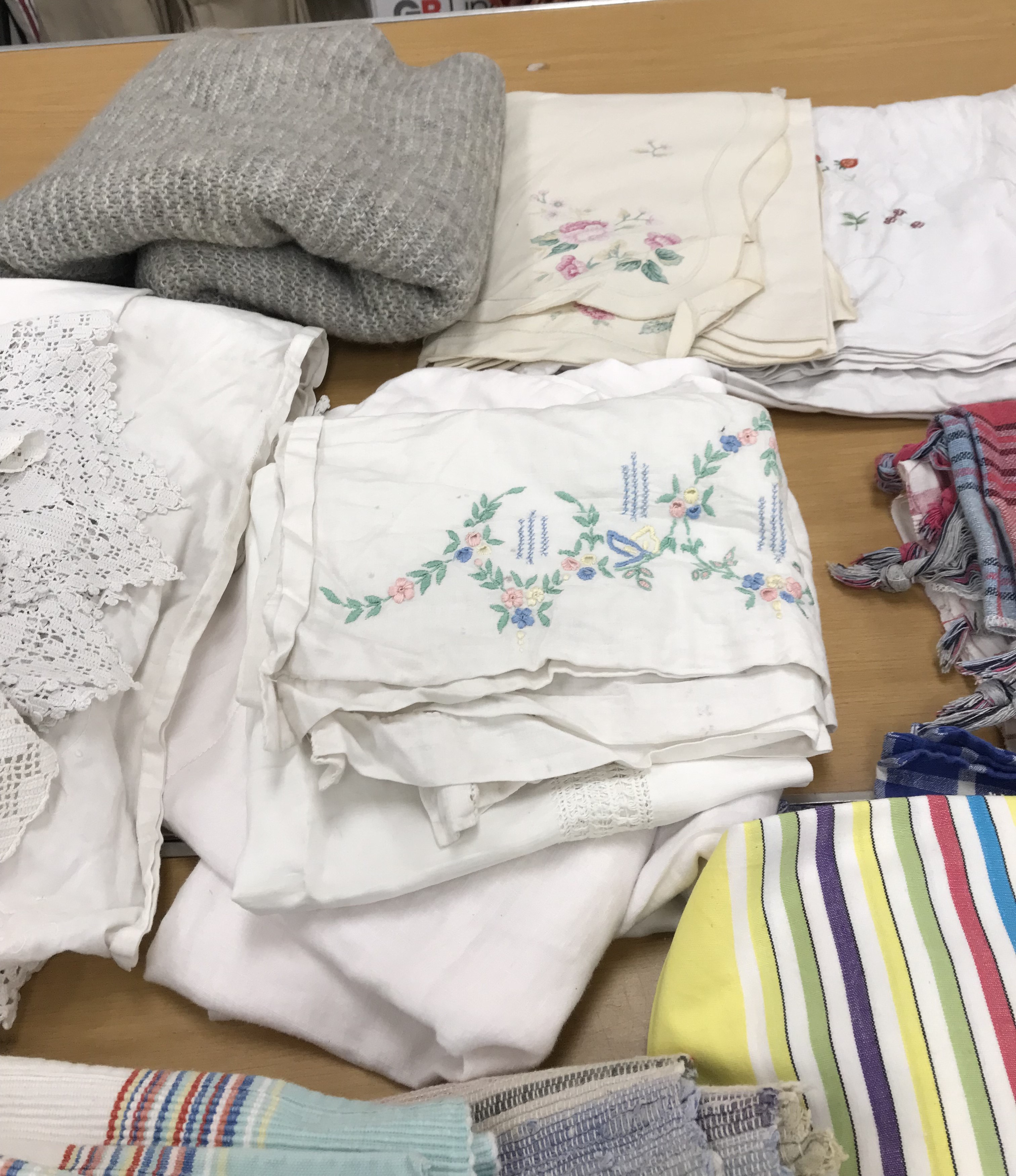 Two boxes of mainly household textiles to include vintage tablecloths, tea towels, aprons, etc. - Image 7 of 8