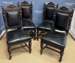 A set of four Victorian carved oak dining chairs with lion mask decorated top rail,