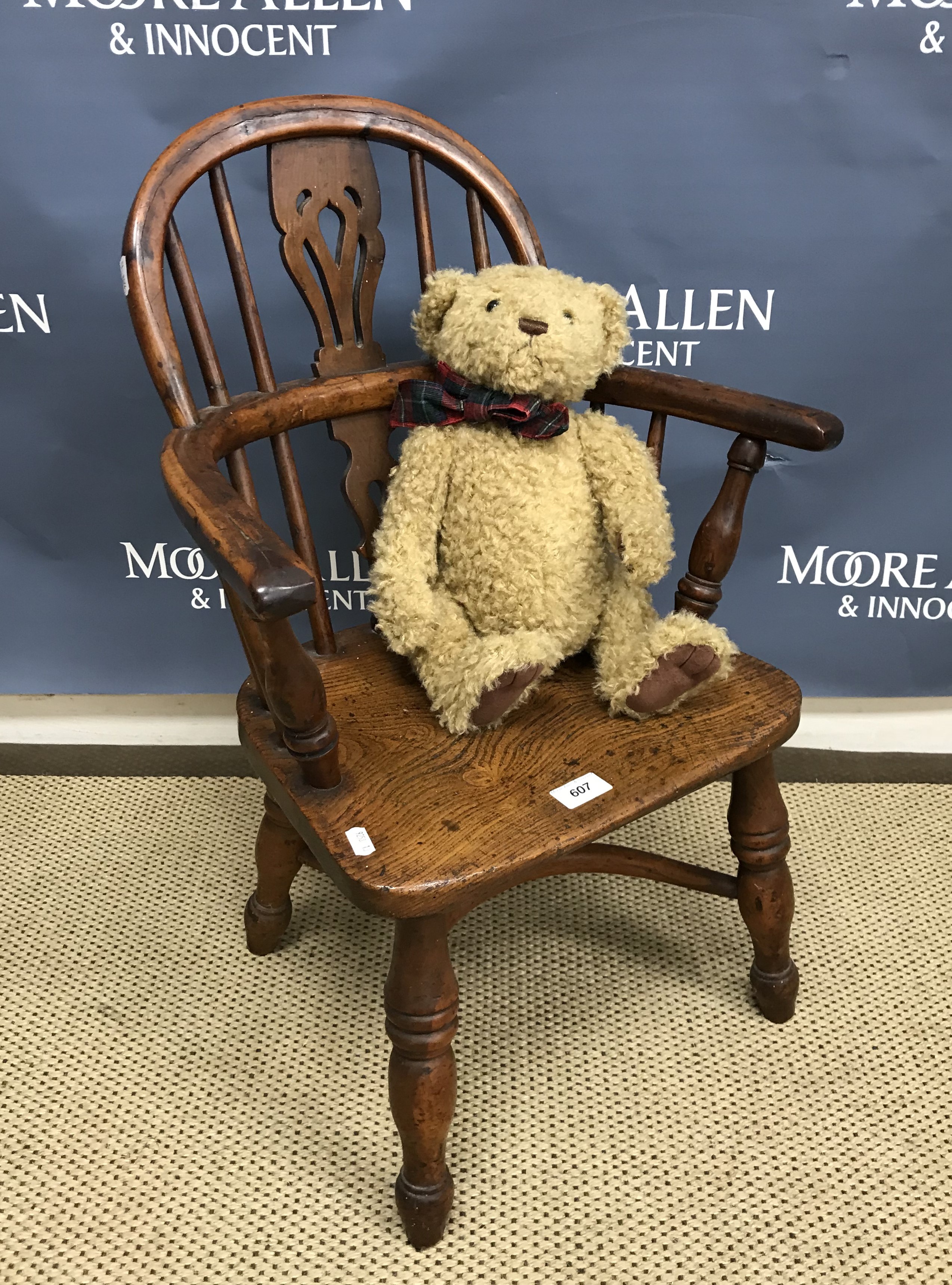 A 19th Century yew wood and elm child's Nottinghamshire style chair in the manner of Nicholson of