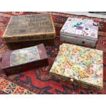 A modern fabric covered sewing box containing various sewing accoutrements including Merchant &