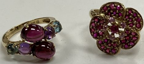 A 9 carat gold and pink sapphire set flower head design dress ring size K, 3.