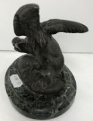 A circa 1900 chocolate patinated bronze figure of a "Bird with worm in its beak",
