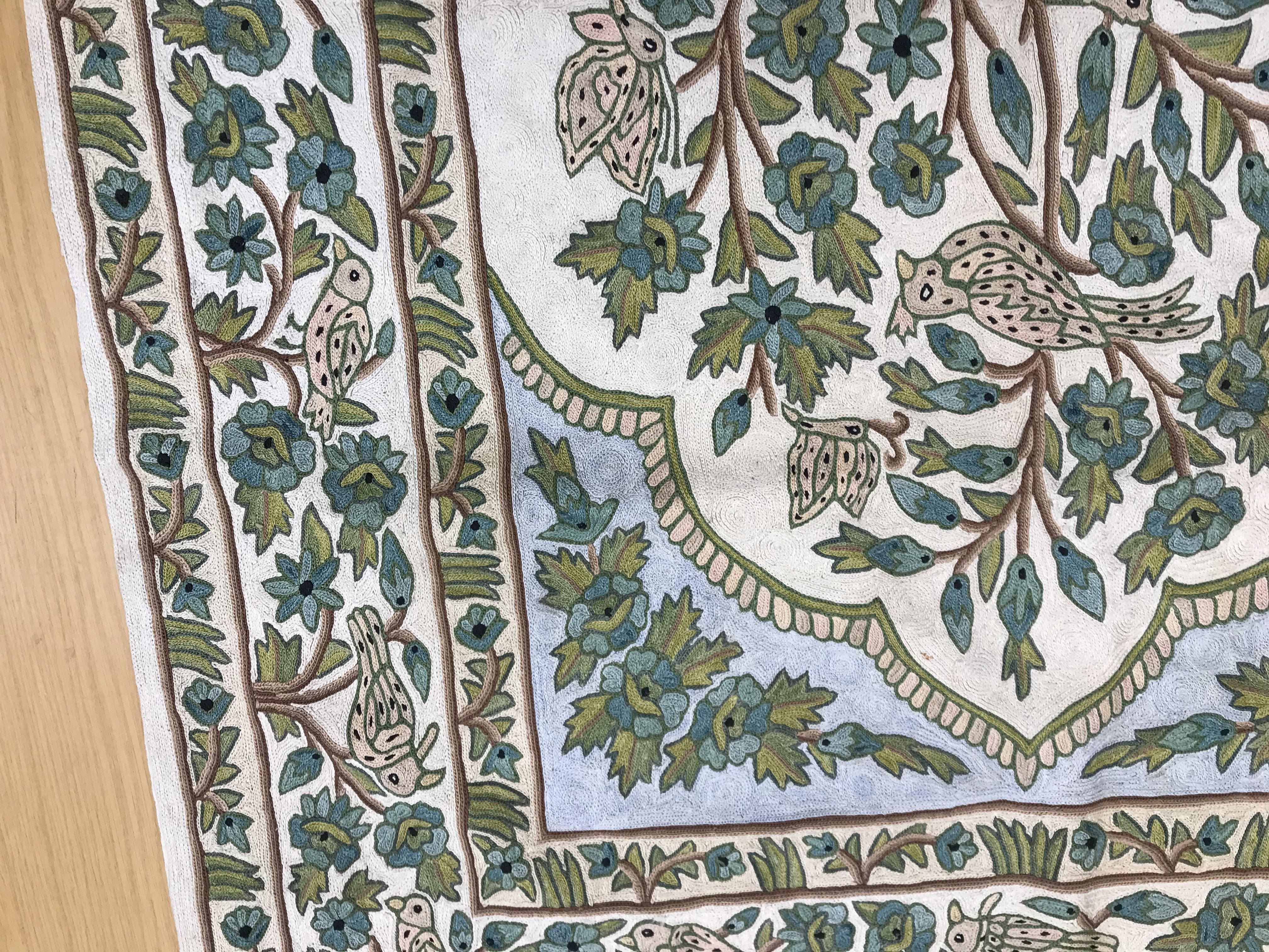 A crewel work panel depicting tree and birds in blue and teal on a cream and blue ground, - Image 10 of 16