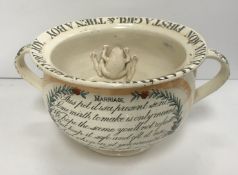 A 19th Century English pottery "Marriage" chamber pot,