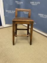A 19th Century mahogany panel seated deportment chair with low bar back on square supports united