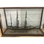 A scale model of the three-masted vessel "Albert" within a glazed five-sided display case (back