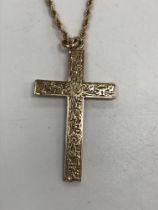 A 9 carat gold engraved cross pendant and rope twist chain, pendant 4.2 cm x 2.