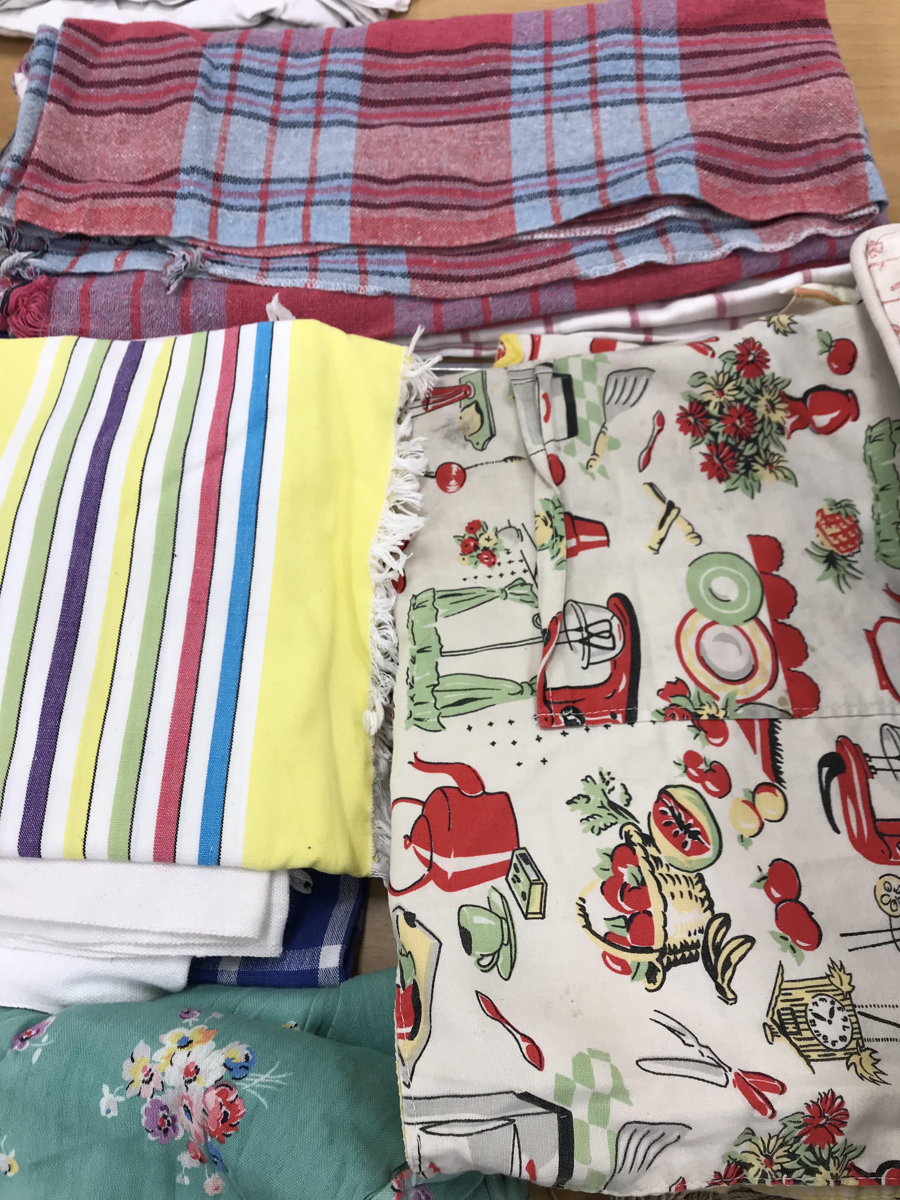 Two boxes of mainly household textiles to include vintage tablecloths, tea towels, aprons, etc. - Image 3 of 8