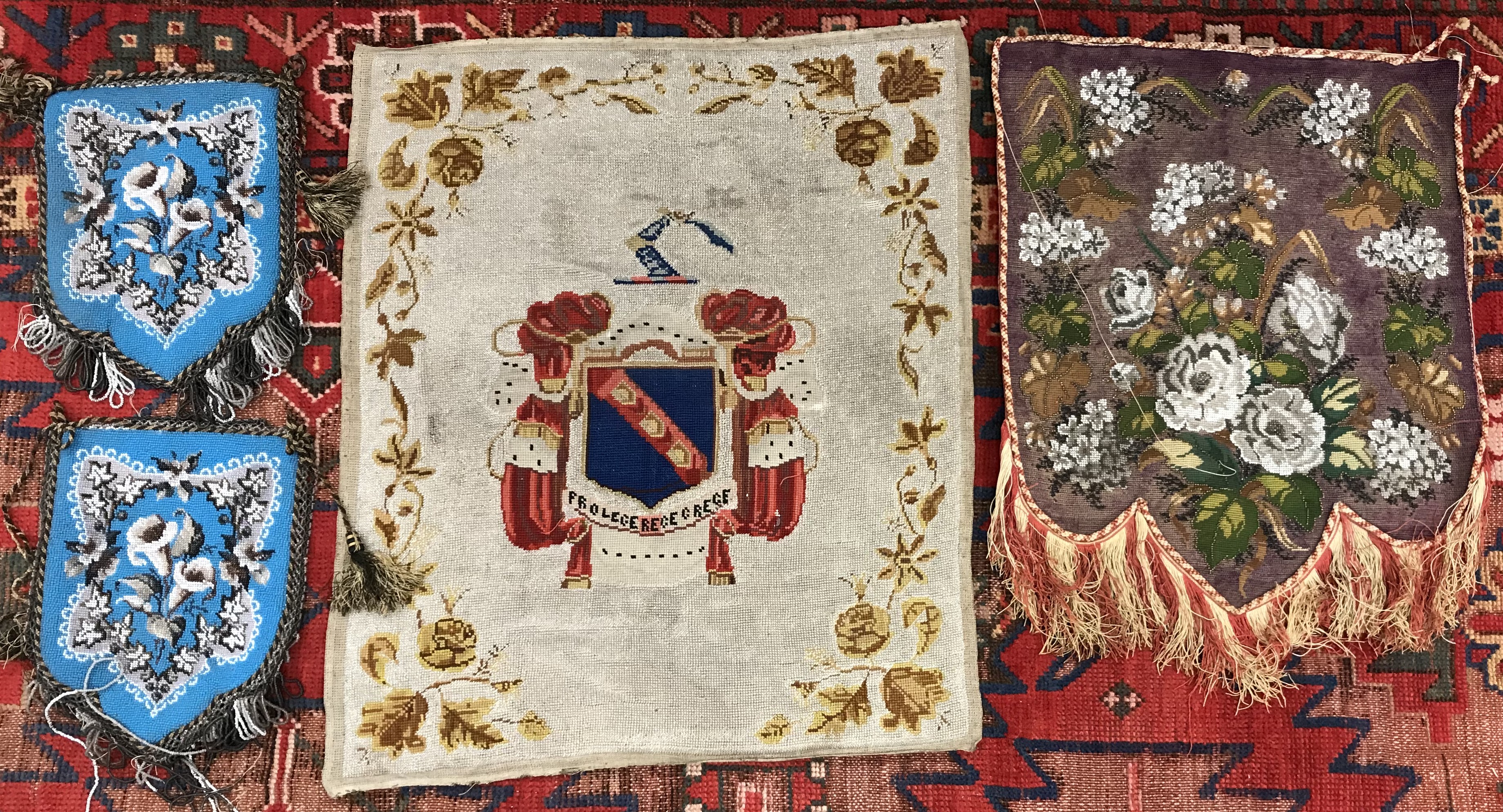 A box containing a 19th Century beaded needlework panel depicting coat of arms within a floral set - Image 2 of 2