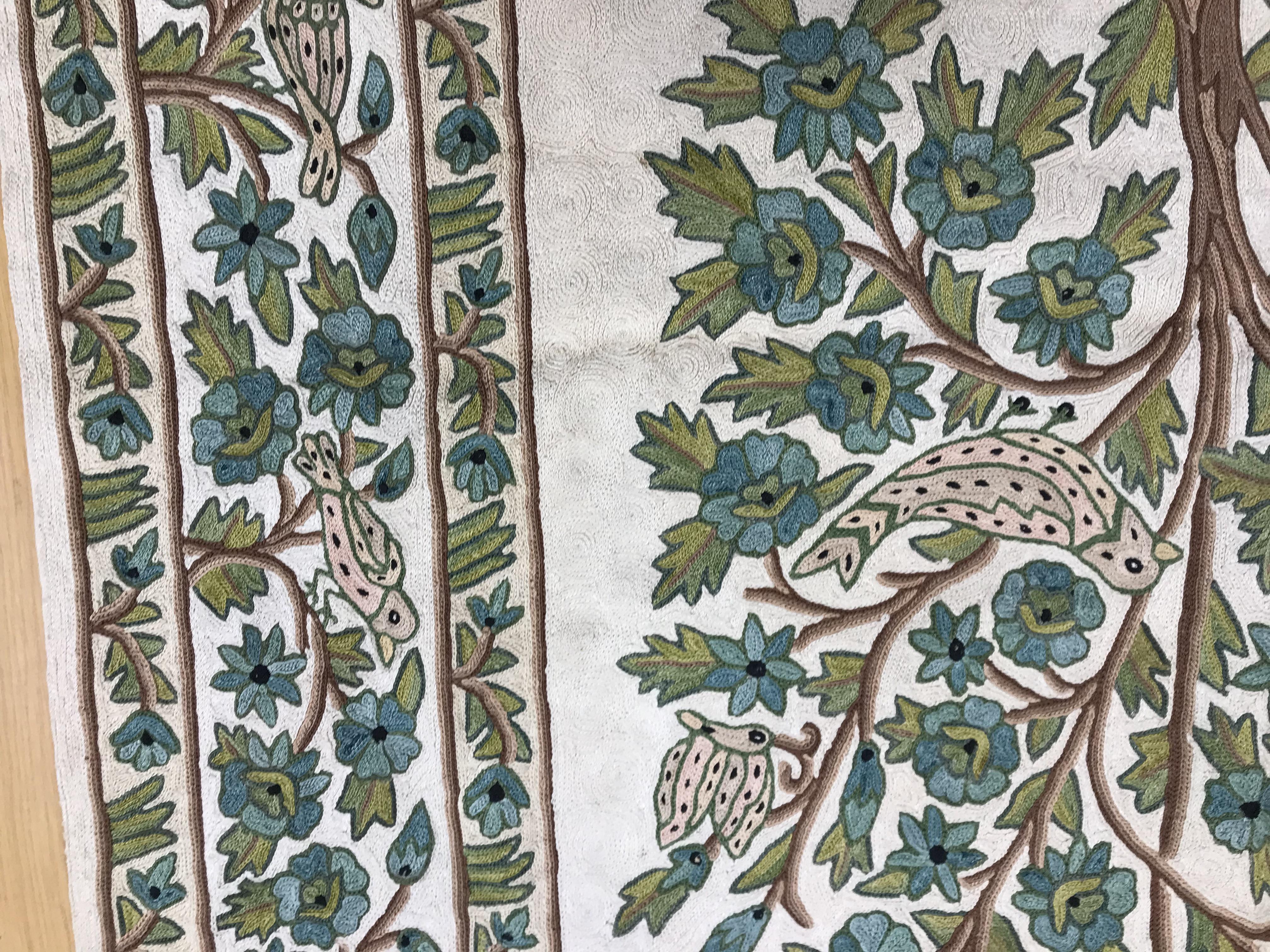 A crewel work panel depicting tree and birds in blue and teal on a cream and blue ground, - Image 5 of 16