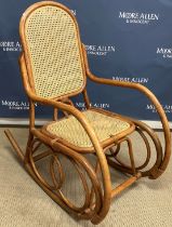 A modern Malaysian bentwood and caned rocking armchair in the manner of Michel Thonet 57 cm wide x