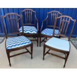 A set of four early 20th Century mahogany framed dining chairs in the Adam taste,