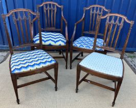 A set of four early 20th Century mahogany framed dining chairs in the Adam taste,