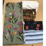 A quantity of silk and silk type fabrics to include two with floral design, one as poppies,