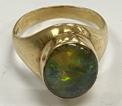An 18 carat gold green opal set dress ring size O, 7.4 g the stone 1.