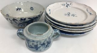 A set of three 19th Century Dutch Delft blue and white floral and foliate decorated shallow bowls
