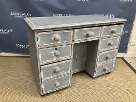 A Victorian pine kneehole desk, the top with moulded edge over a single long drawer (as three),