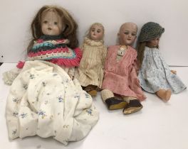 A collection of various early 20th Century dolls including a Simon & Halbig bisque-headed doll with