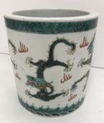 A late 19th Century Chinese cylindrical pot, decorated with five-toed fire dragons,