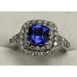 An 18 carat white gold tanzanite and diamond set dress ring size K together with Ankhor Cert.