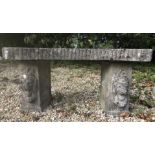 A composite stone garden bench,