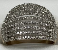 A 9 carat gold dress ring set with nine bands of small diamonds size O, 3.