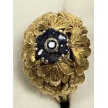 An 18 carat yellow gold leaf design dress ring size L set with central cluster of sapphires in