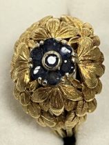 An 18 carat yellow gold leaf design dress ring size L set with central cluster of sapphires in