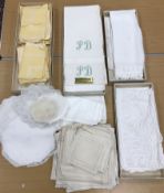 A collection of linen table ware and hammam type towels some in original boxes