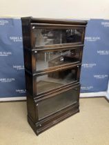 A Globe-Wernicke oak four section bookcase on typical plinth base, 86.