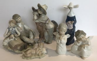 A collection of six Lladro figures and figure groups including young couple seated with puppy,