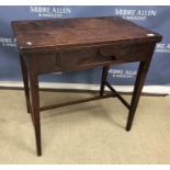 A 19th Century mahogany campaign tea table, the double fold-over top opening on to lopers,