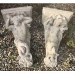 A pair of composite stone garden wall brackets as a merman and mermaid 53 cm long x 23 cm deep