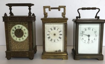 A circa 1900 French lacquered brass cased carriage clock with pierced filigree style decoration and