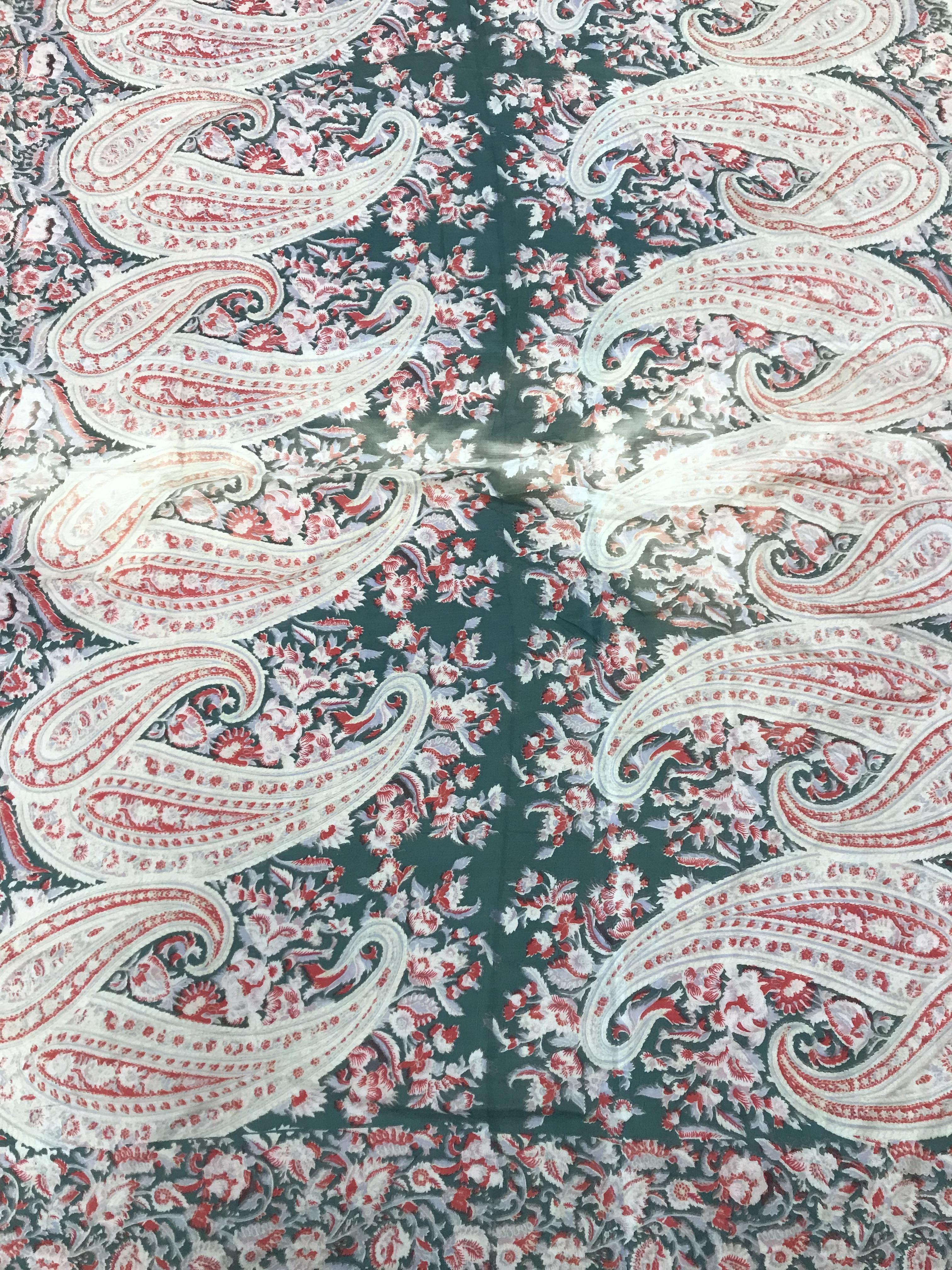 A coral and green sari with paisley design probably cotton lawn 5.4 m x 1.