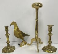 A 19th Century brass wig stand on tripod base 33 cm high,