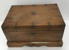A vintage Indian teak and brass bound table top chest,