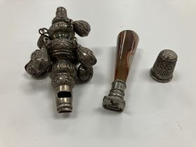 A Victorian silver baby's rattle, a Victorian silver thimble 1.