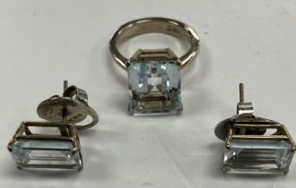 An 18 carat white gold and aquamarine dress ring size K, the rectangular stepped stone approx. 1.