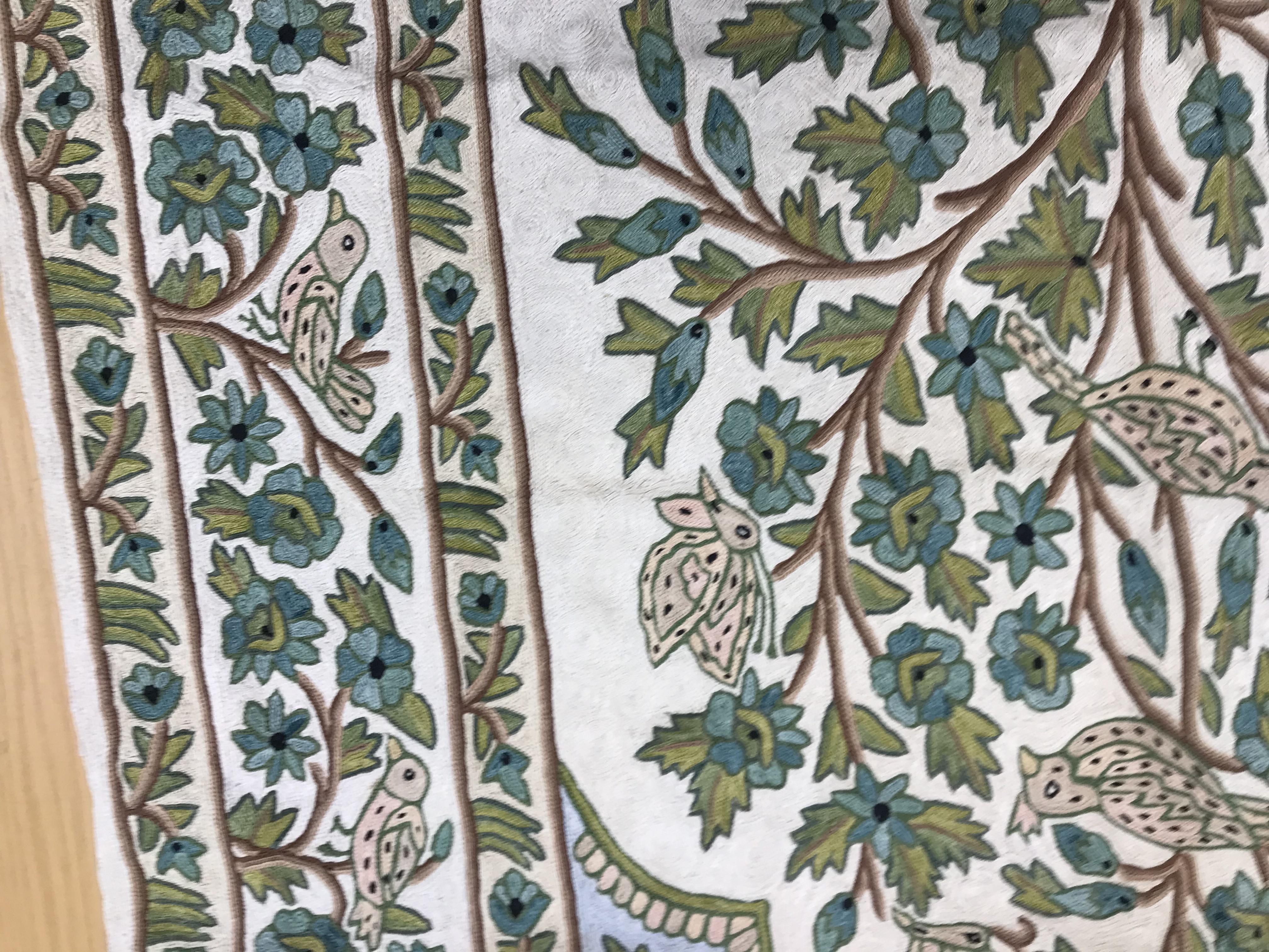 A crewel work panel depicting tree and birds in blue and teal on a cream and blue ground, - Image 9 of 16