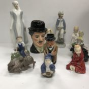 A collection of figurines, Toby jugs, etc,