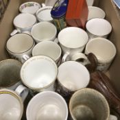 A box containing assorted late 20th Century Royal Commemorative wares to include mugs, tins, etc,