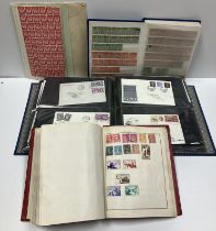 A box of various stamps to include four first day cover albums, an album of world stamps,