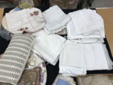 Two boxes of assorted bed linen including linen sheets, three cushions of various designs,